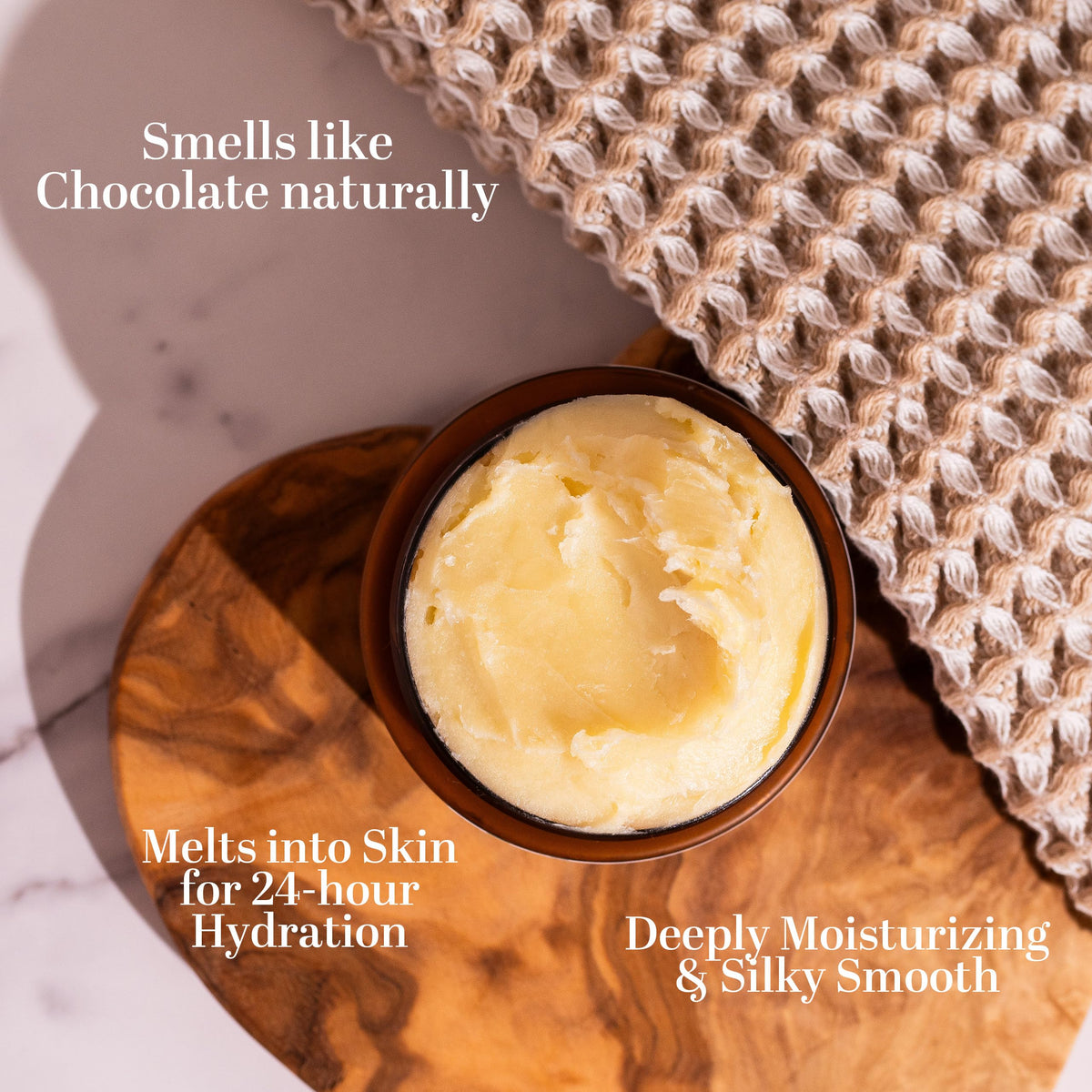 Better Shea Butter on bathroom shelf next to towels suggesting daily skincare routine