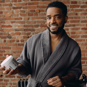 Bevel body cream on bathroom counter used after shower for fast-absorbing benefit