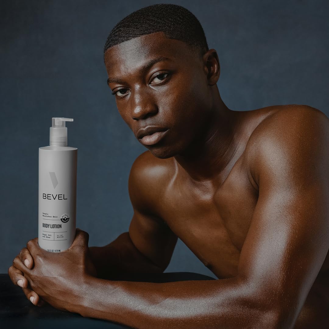 Bevel bottle beside a hand for size comparison highlighting the generous 16 oz supply