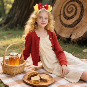 bianbaistar bow detail with amber gemstone and honey dipper charm, shows decorative focus