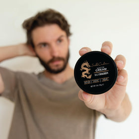 Billy Jealousy jar on grooming counter next to brush and towel for daily routine styling