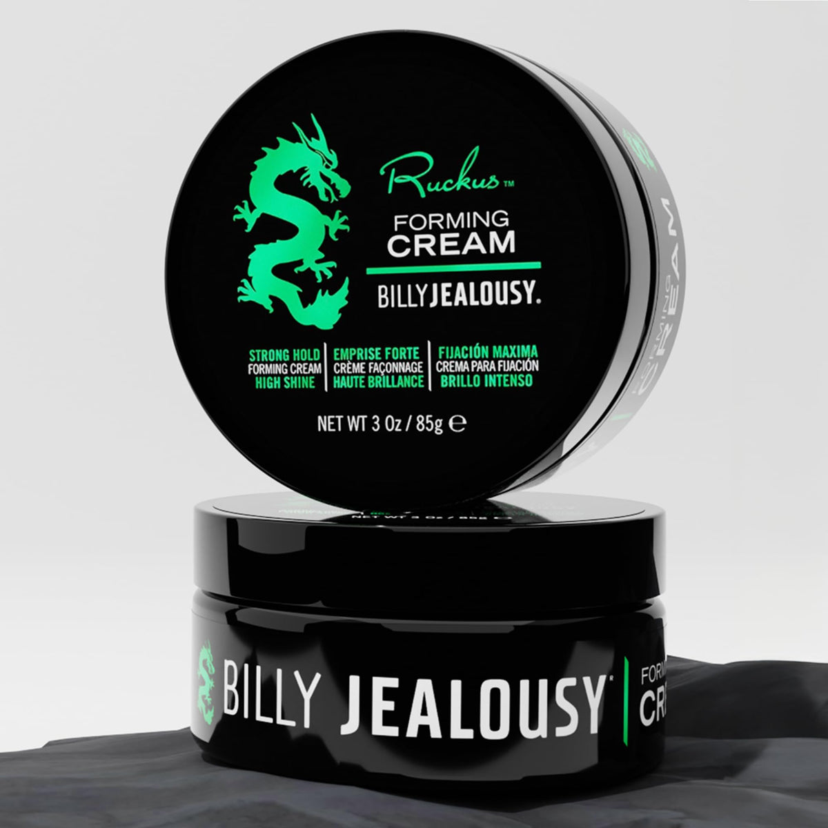 Billy Jealousy next to a coin for size comparison highlighting compact 3 oz travel-friendly benefit
