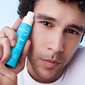 Bioderma bottle beside towel to show size and daily routine convenience