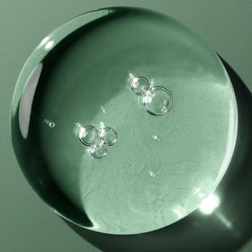 Biolage spray applied to hair demonstrating frizz control benefit