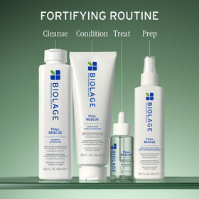 Biolage conditioner being applied to wet hair to reduce breakage