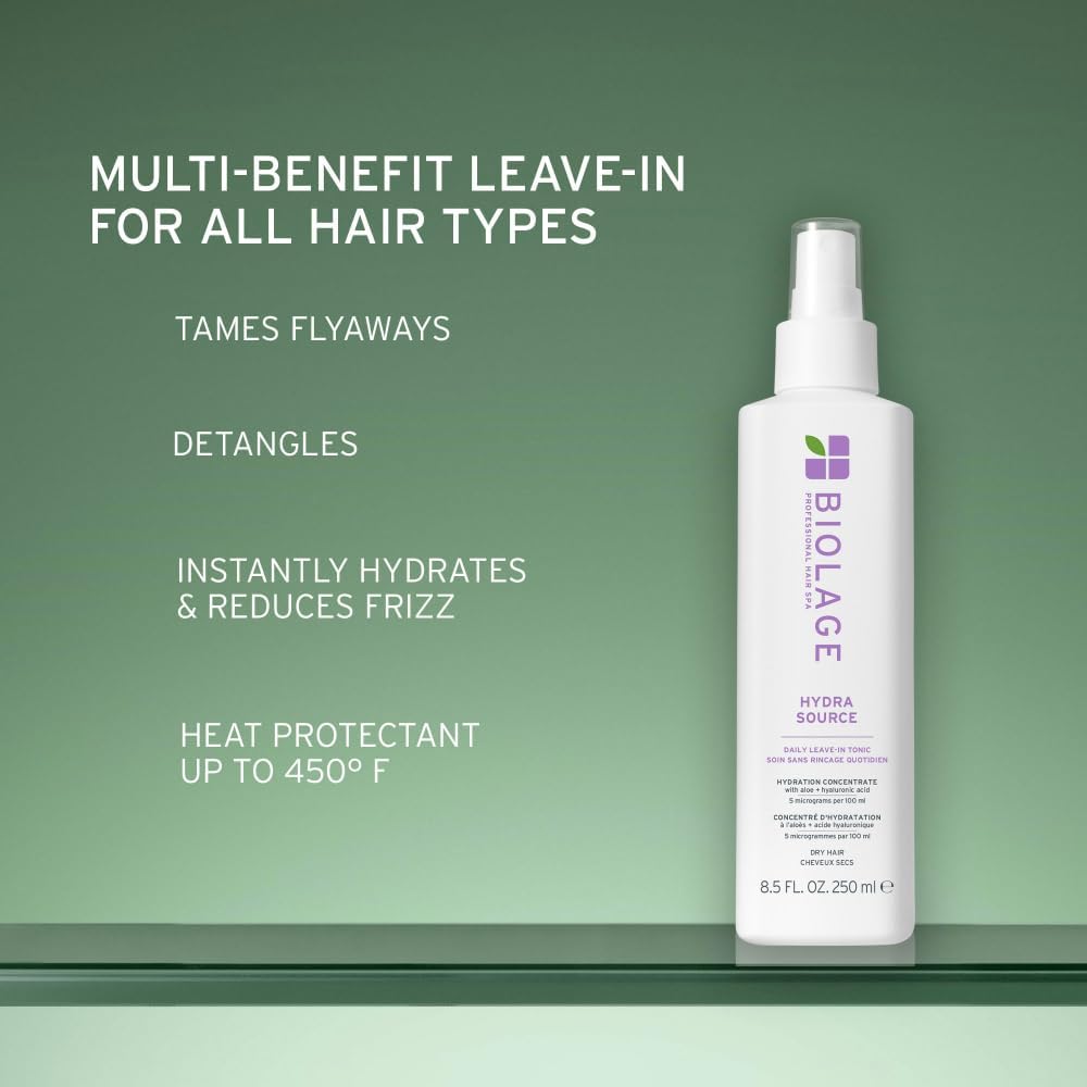 Biolage bottle in hand illustrates 13.5 fl oz size and grip