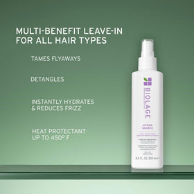 Biolage bottle in hand illustrates 13.5 fl oz size and grip