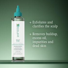Biolage product being applied to scalp demonstrating easy section use