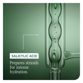 Biolage bottle held in hand to show 13.5 oz scale for accurate size expectation