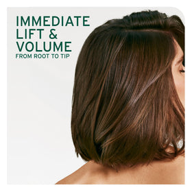 Biolage conditioner being dispensed to show creamy lightweight texture