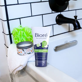 Bioré 5 ounce tube next to hand for scale showing convenient travel-friendly size