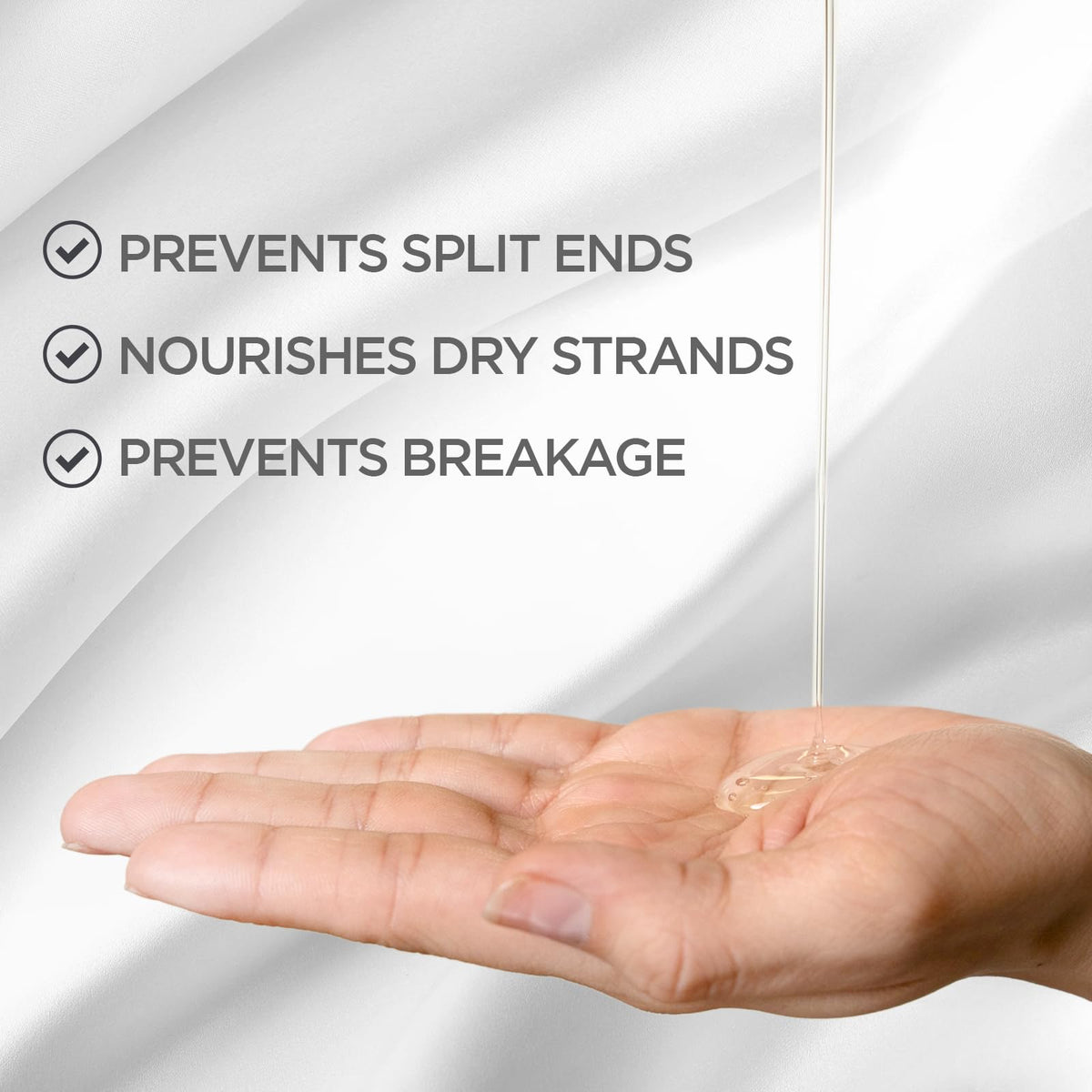 BioSilk in palm being applied to hair for smoother, easier styling