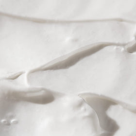 Biossance label close-up showing ingredient claims and vegan formulation benefit