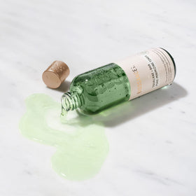 Biossance toner applied to hand demonstrating easy application and gentle exfoliating benefit