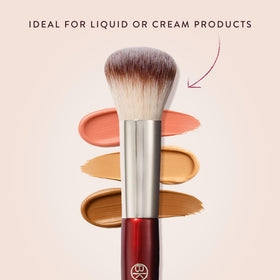 BK BEAUTY brush in hand to show size and easy control for quick application