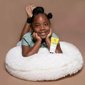 black girl sunscreen in beach bag ready for travel and outdoor play