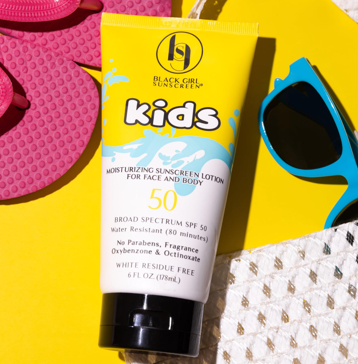 black girl sunscreen label closeup highlighting reef-friendly ingredients
