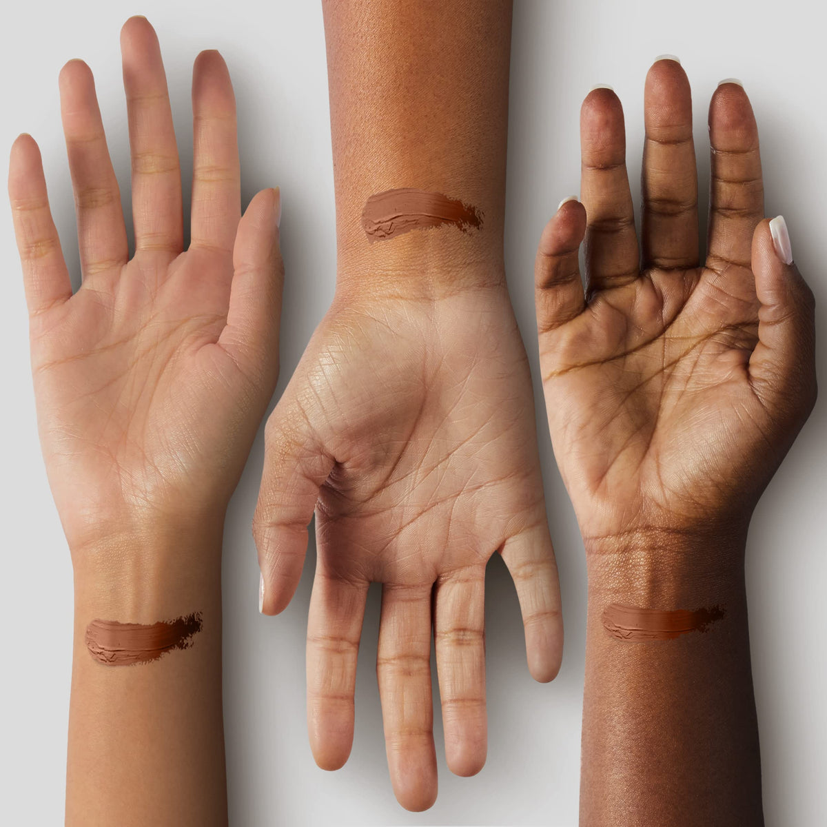 Black Radiance swatch on hand showing Beautiful Bronze shade for accurate color match