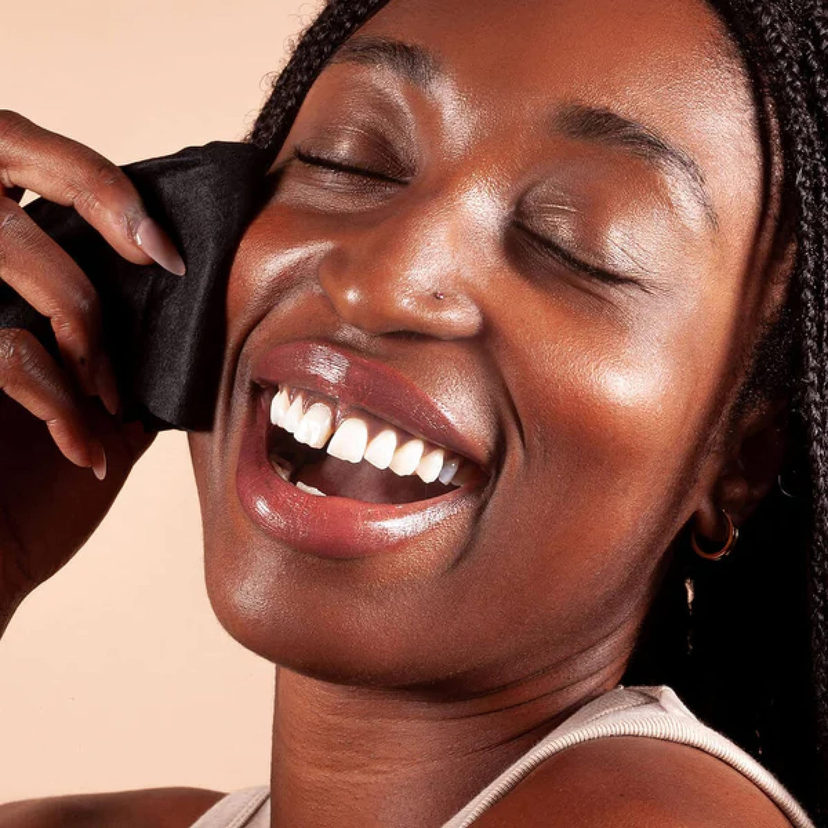BLAQ ingredients label closeup highlighting charcoal and AHA benefit