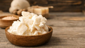 Bless International hand applying butter demonstrating quick skin absorption