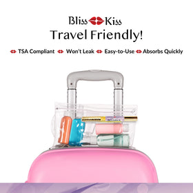 Bliss Kiss pen next to a coin for size scale, highlighting travel-friendly convenience