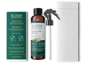 Bloom Health Goods misting onto scalp in hand, demonstrates easy leave-in application benefit