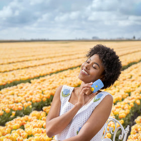 Bloomeffects size comparison next to phone showing portable, purse-friendly convenience