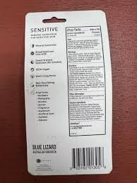 BLUE LIZARD sunscreen stick in a beach setting promoting reef-friendly use
