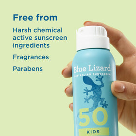Child using Blue Lizard spray at the beach showing 80-minute water resistance