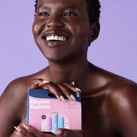 Blume travel kit next to passport to illustrate TSA-approved size convenience