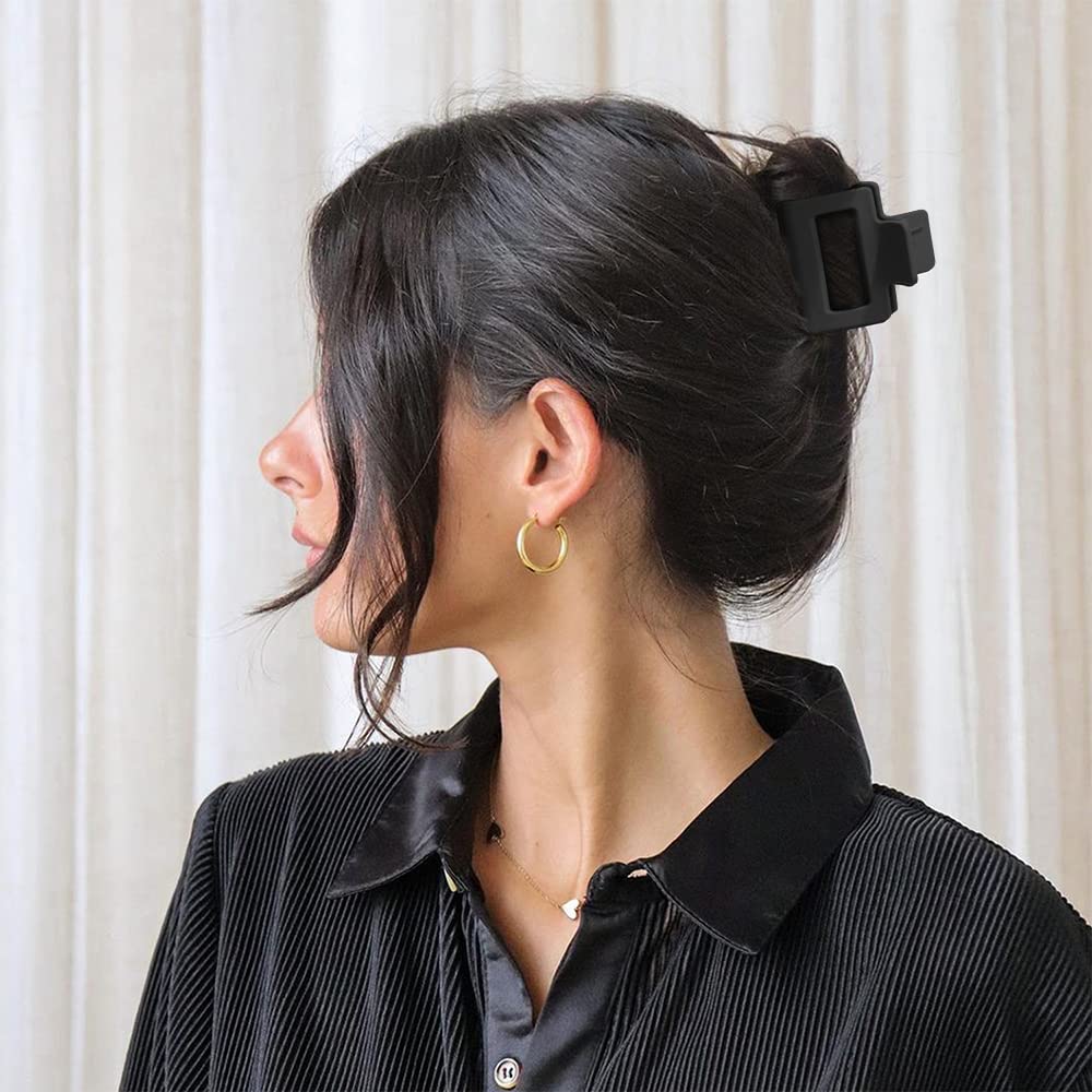 Bmobuo held in hand for scale demonstrating compact size and travel convenience