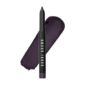 Bobbi Brown front packaging showing aubergine shade and compact design benefit: travel-ready