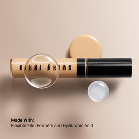 Bobbi Brown concealer held in hand for size comparison showing portable 0.27 fl oz convenience