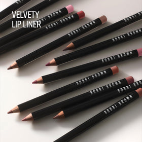 Bobbi Brown lip pencil in hand for scale and travel-friendly benefit
