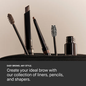 Bobbi Brown tube next to compact mirror for scale, travel-friendly brow gel