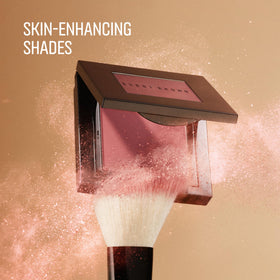 Bobbi Brown blush brush applying color to cheek benefit: seamless blend and buildability
