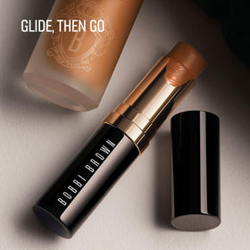 Bobbi Brown stick tucked in a makeup bag in a lifestyle shot, showing on-the-go convenience benefit