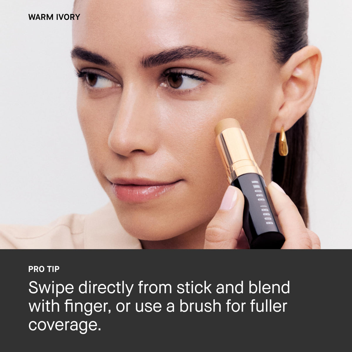 Bobbi Brown foundation stick in hand for size comparison, highlighting travel-friendly benefit