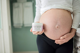 Body Boost applied to pregnant belly demonstrating gentle hydration and comfort
