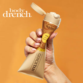 Hand holding Body Drench 8 fl oz bottle to show size and travel-friendly convenience