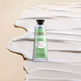 BODY & EARTH # LOVE cream being smoothed on hands showing non-greasy finish benefit: quick absorption
