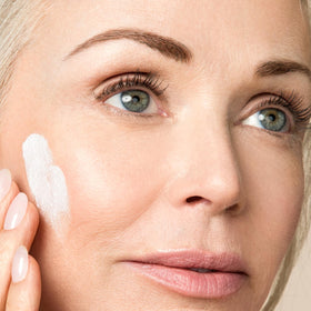 BODY FIRM bottle on bathroom shelf in lifestyle setting suggesting daily skincare routine