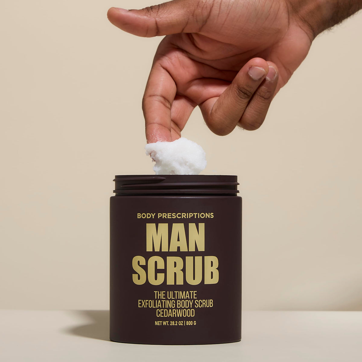 Body Prescriptions scrub texture close-up showing exfoliant grit for effective skin smoothing