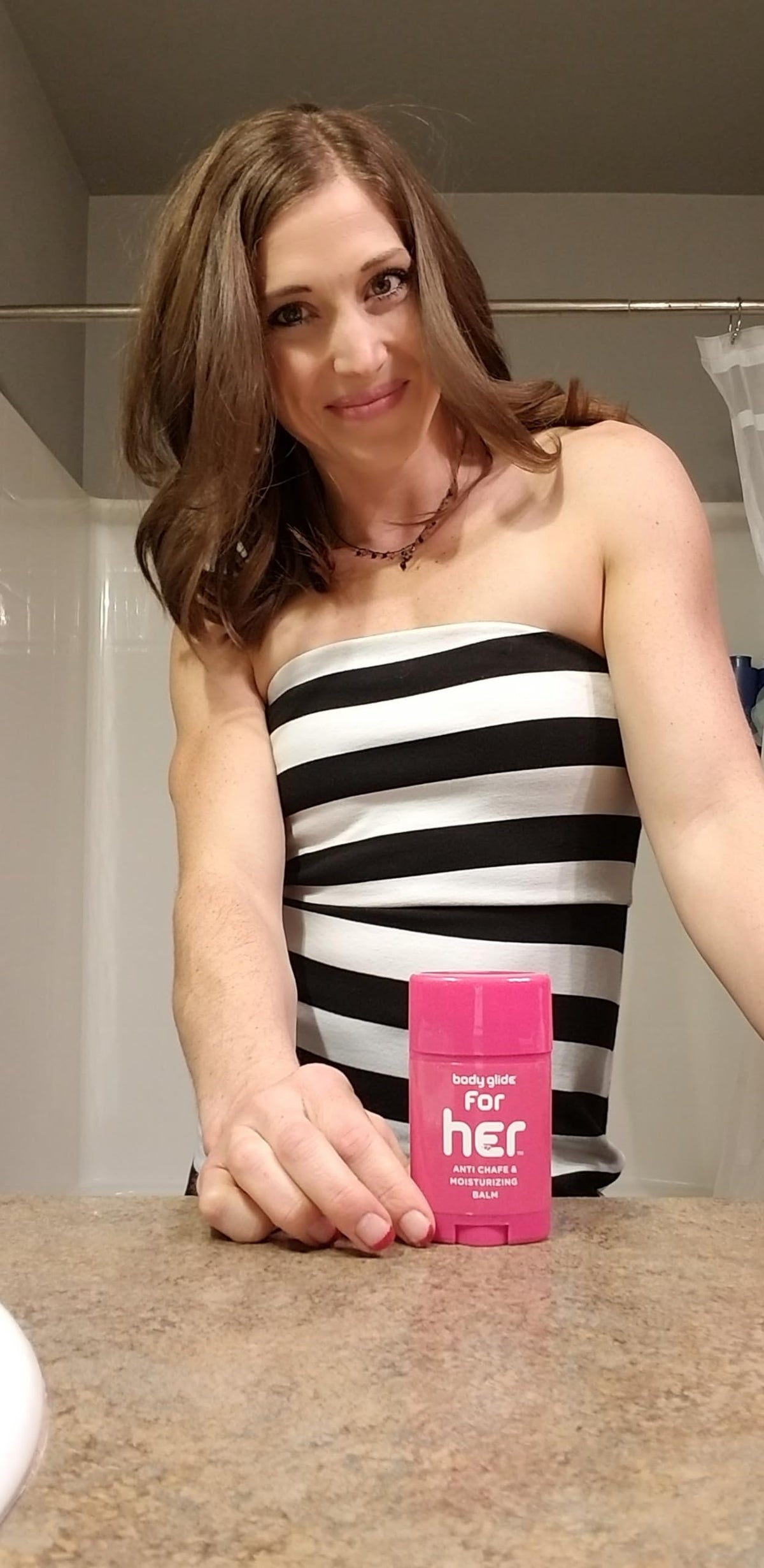 BodyGlide For Her label close-up listing plant-derived ingredients and vitamins