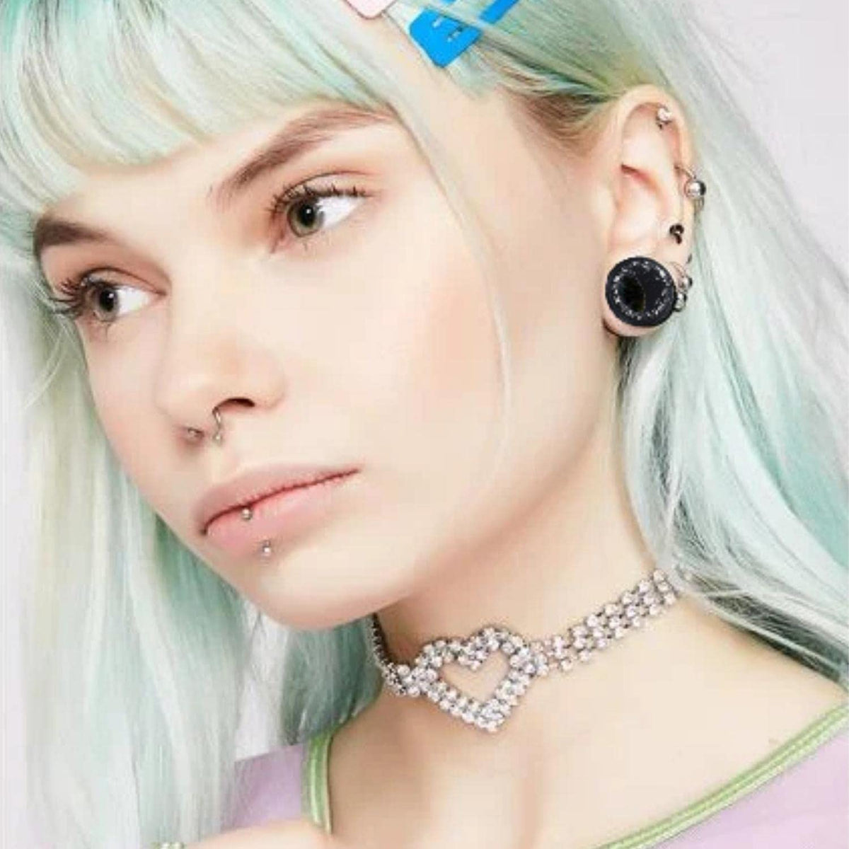 BodyJ4You hand applying balm to earlobe illustrating easier taper insertion