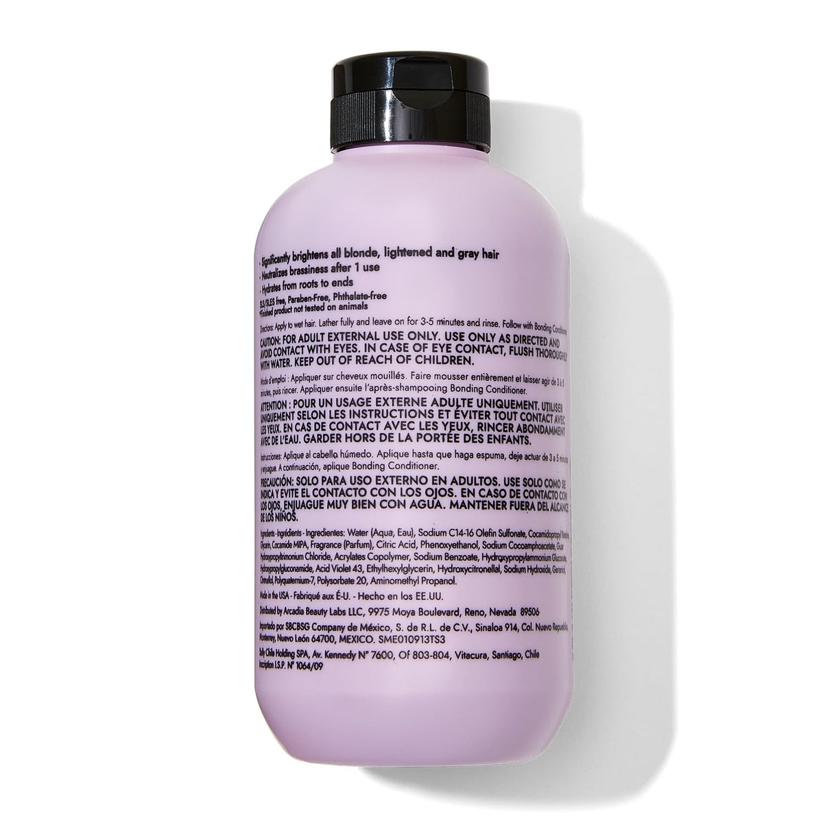 Hand holding Bondbar 8 fl oz bottle to show size and travel-friendly benefit