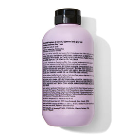 Hand holding Bondbar 8 fl oz bottle to show size and travel-friendly benefit