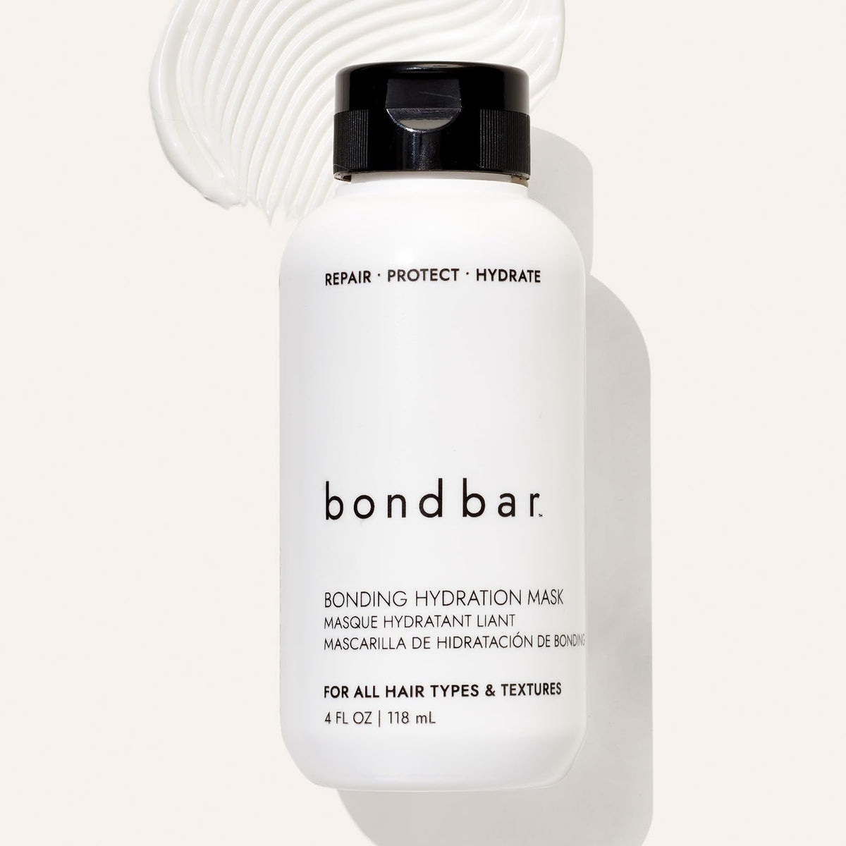 Bondbar 4 fl oz bottle held in hand showing compact travel-friendly size
