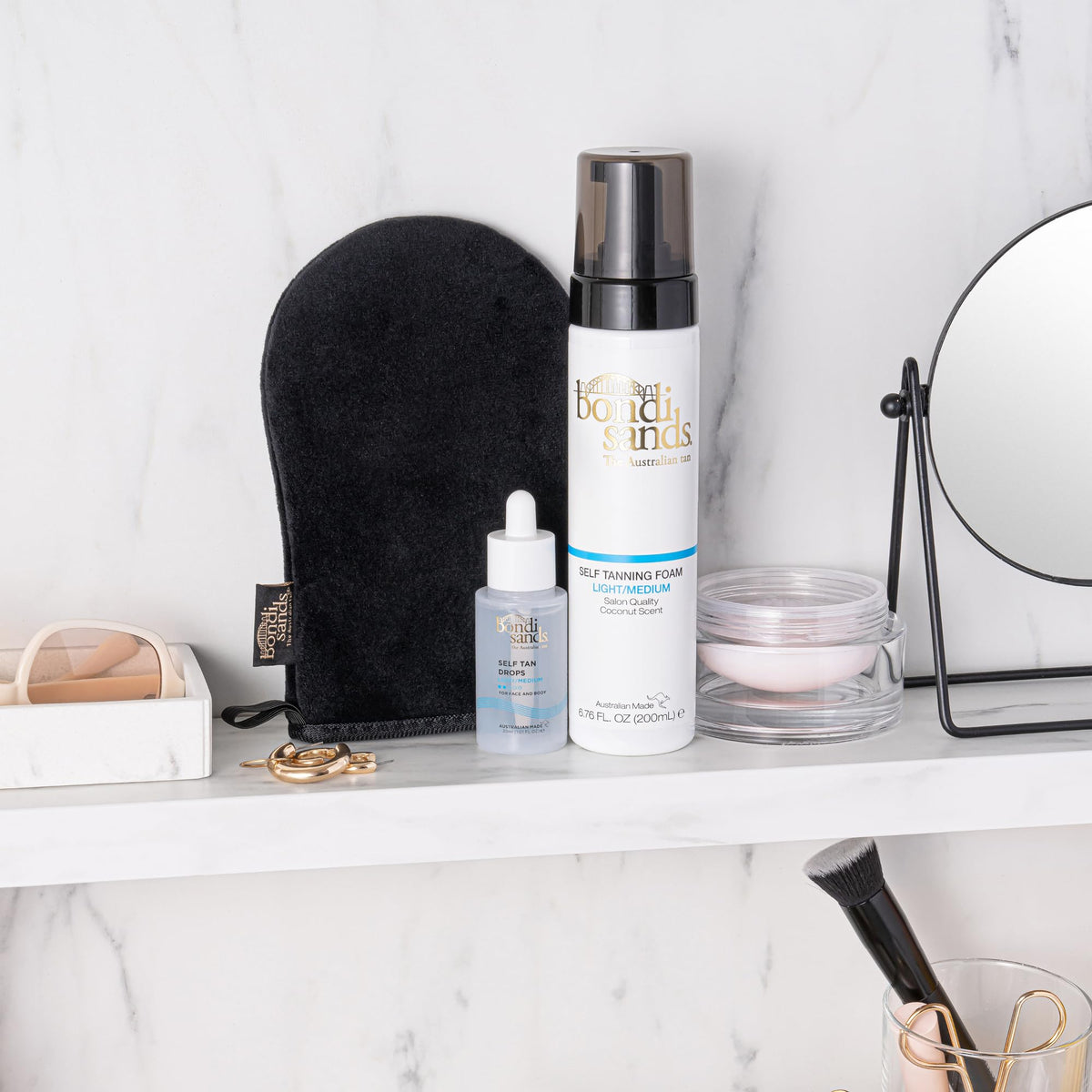 bondi sands applied to face in mirror demonstrating gentle application and radiant finish
