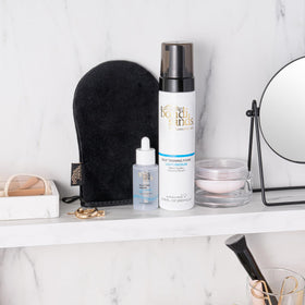 bondi sands applied to face in mirror demonstrating gentle application and radiant finish